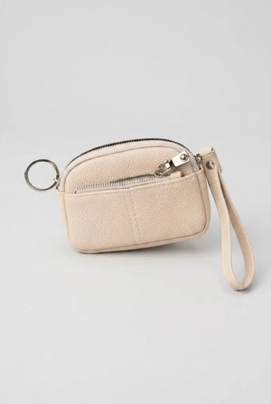 Cream coin pouch wristlet front view with key ring attachment