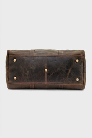 Base of the duffel bag showing protective brass studs