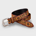 Sunflower hand-tooled tan leather belt coiled, showing buckle and tooled strap