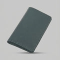 Artizanni mini leather travel journal in olive green, angled view