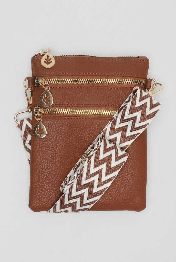 Artizanni women's vegan leather crossbody bag in tan with patterned guitar strap