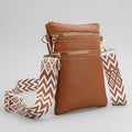 Artizanni vegan leather crossbody bag in tan, shown with detachable strap