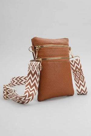 Artizanni vegan leather crossbody bag in tan, shown with detachable strap