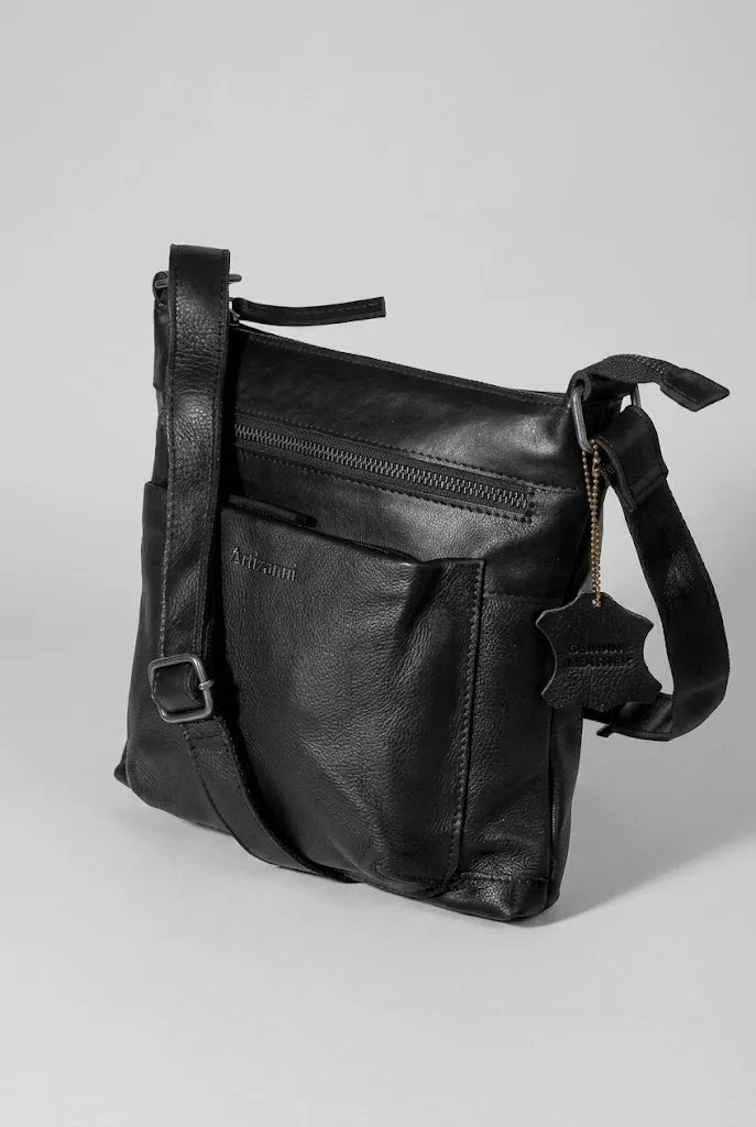 Black leather satchel bag AZ 060 angled view showing front zip pocket