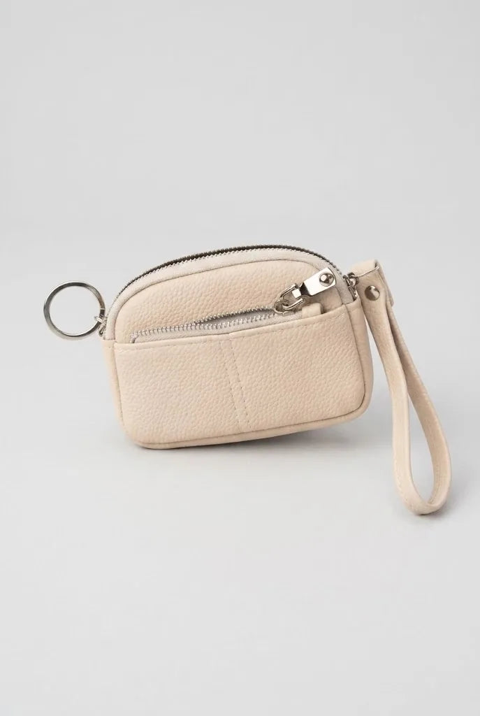 Cream coin pouch wristlet front view with key ring attachment